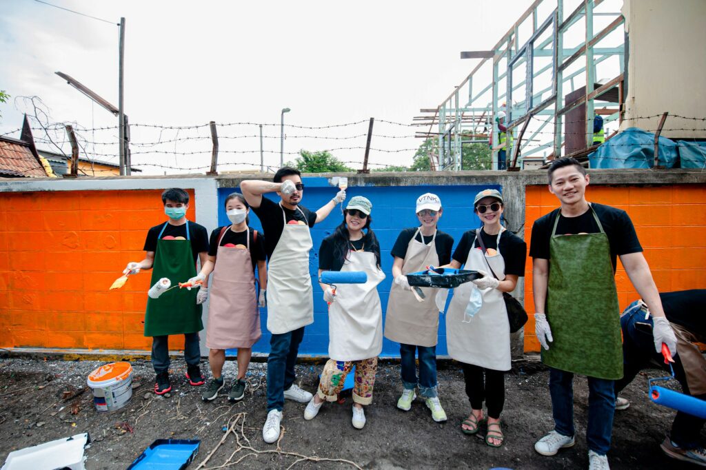 Participants engaged in a variety of renovation tasks including painting classrooms repairing furniture and landscaping school grounds
